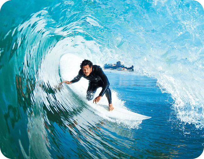 surfer under vawe image