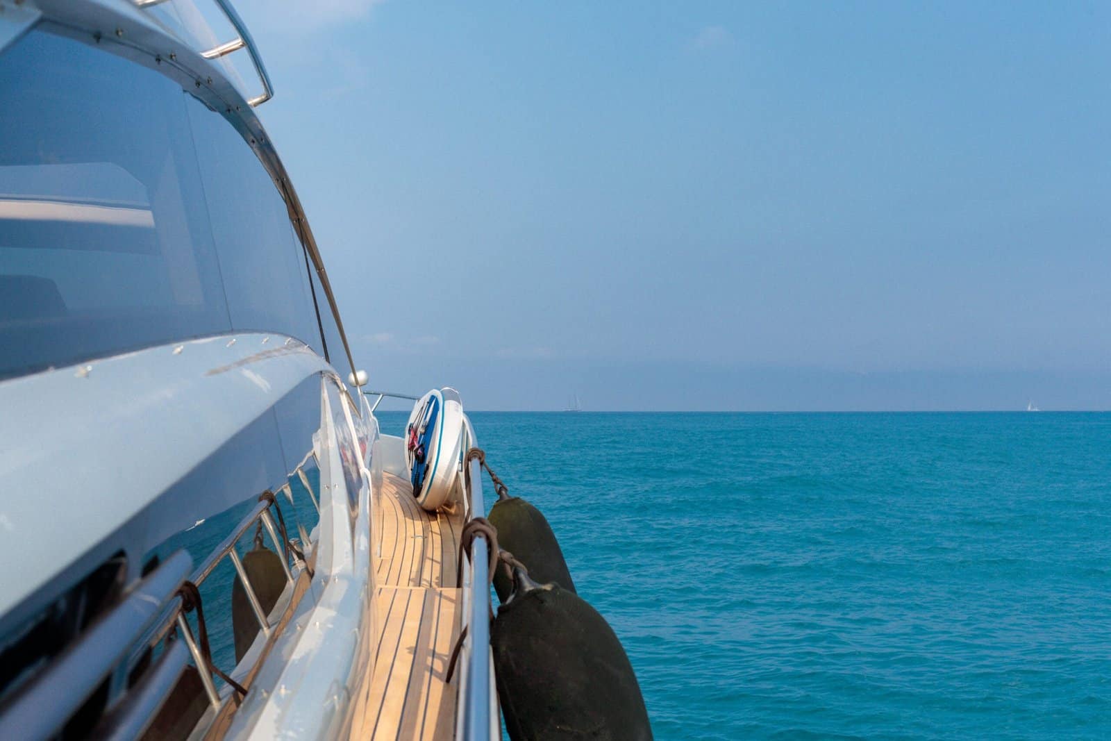 Beautiful shot from the yacht of the sea with a blue sky in the background