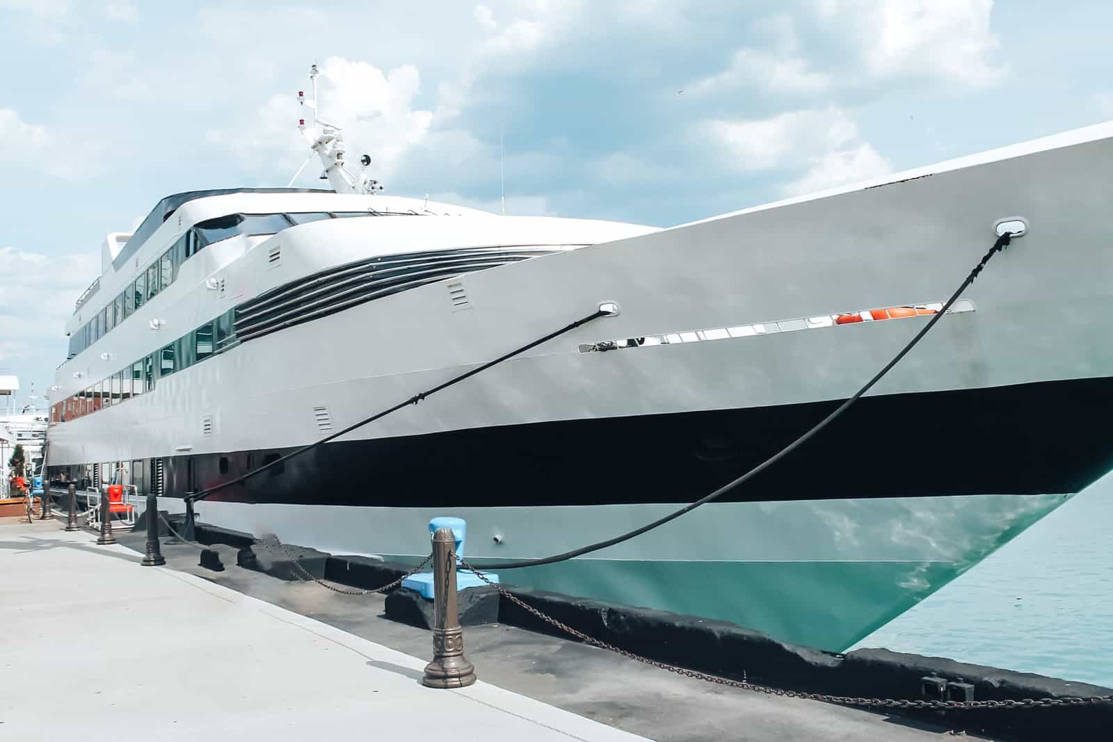 Big beautiful yacht docked in the bay of ships on a clear sunny day