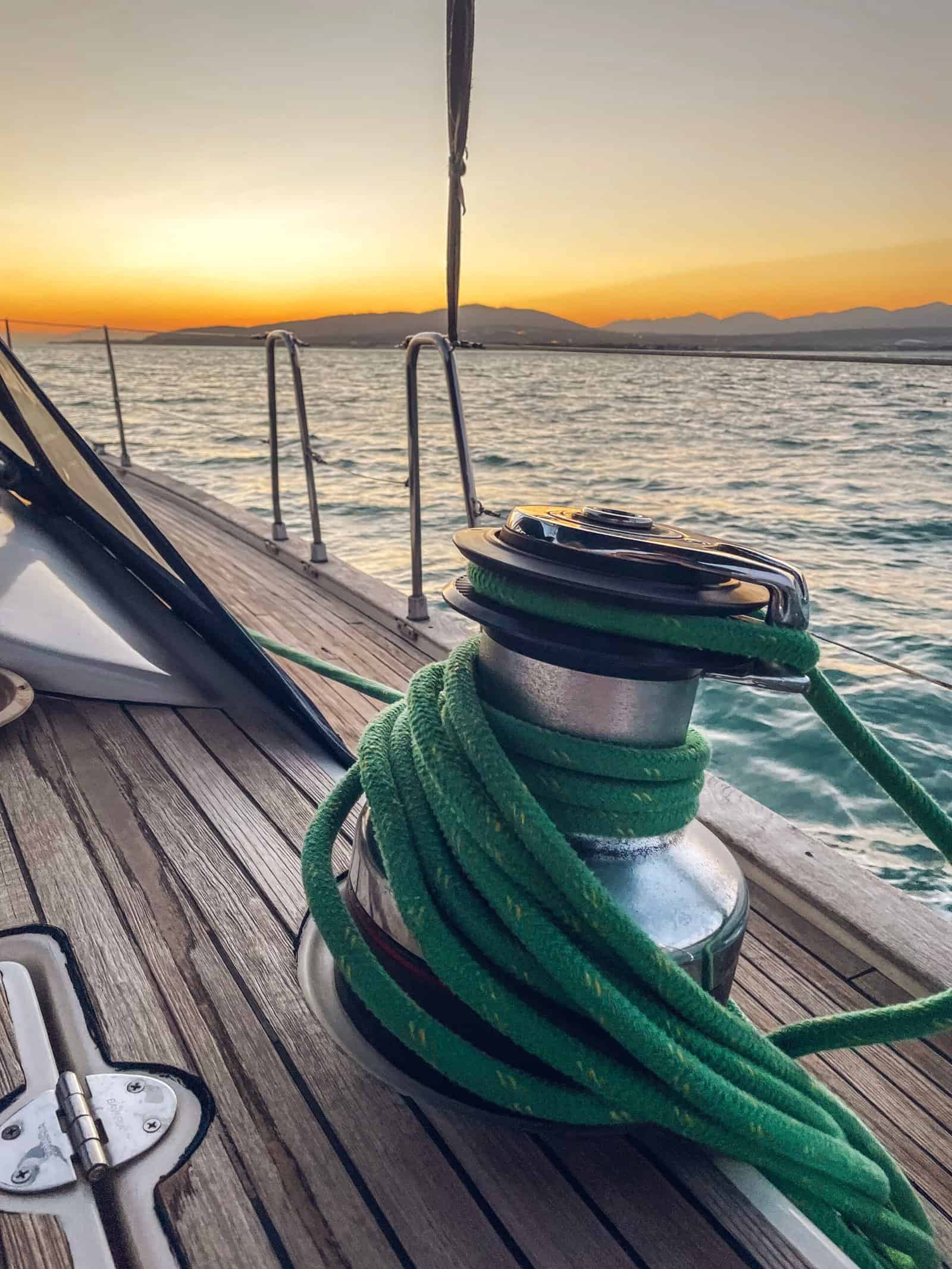 Sailboat winch and rope yacht detail. Yachting