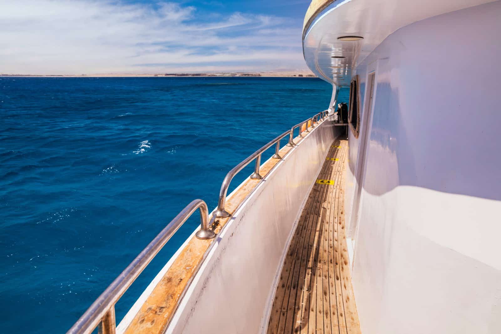 Deck of cruise yachts in clear water near a coral reef. Red Sea, Egypt.