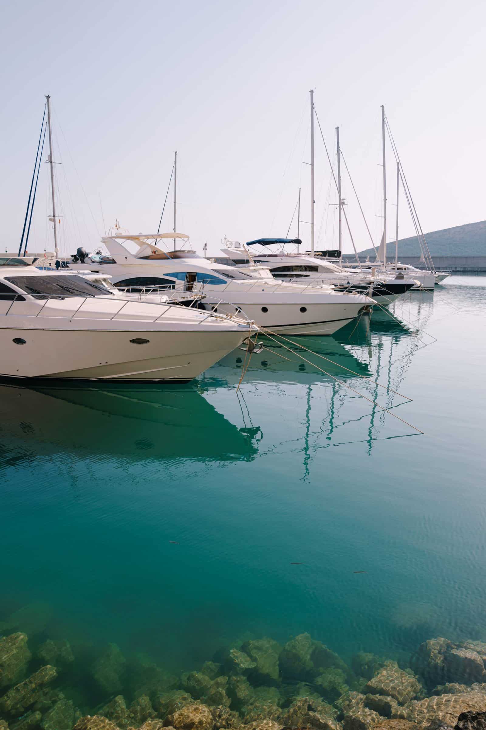 Row of moored yachts. Lustica Bay